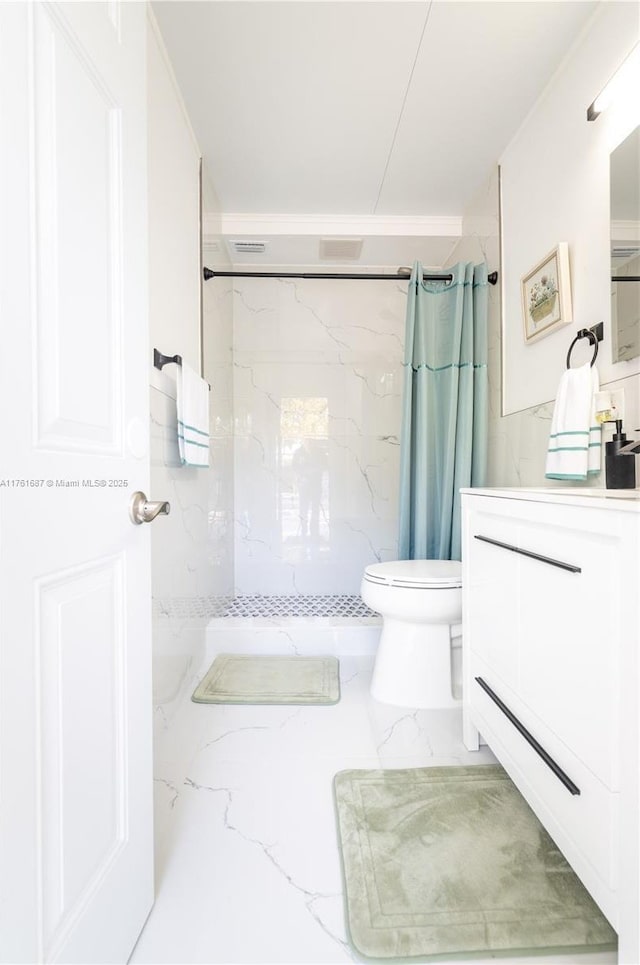 full bath featuring vanity, toilet, marble finish floor, and a marble finish shower