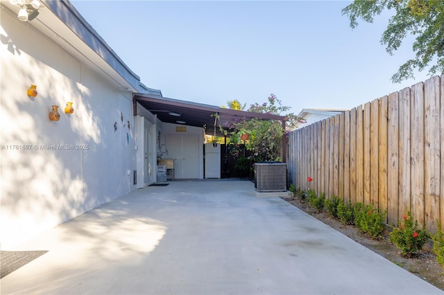 view of patio / terrace featuring central AC and fence