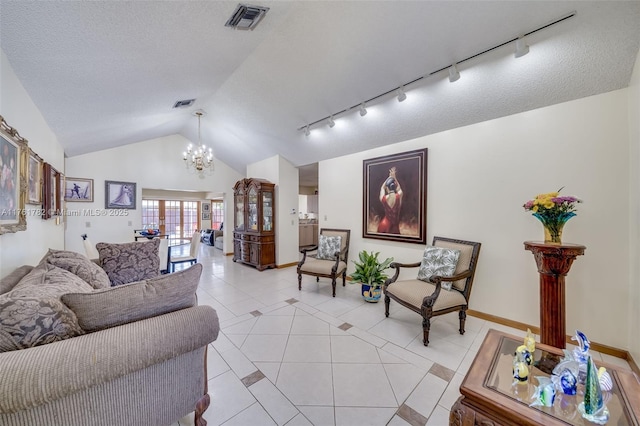 living room featuring lofted ceiling, an inviting chandelier, baseboards, light tile patterned flooring, and visible vents