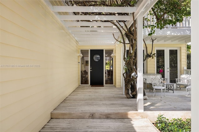 property entrance with french doors and a pergola