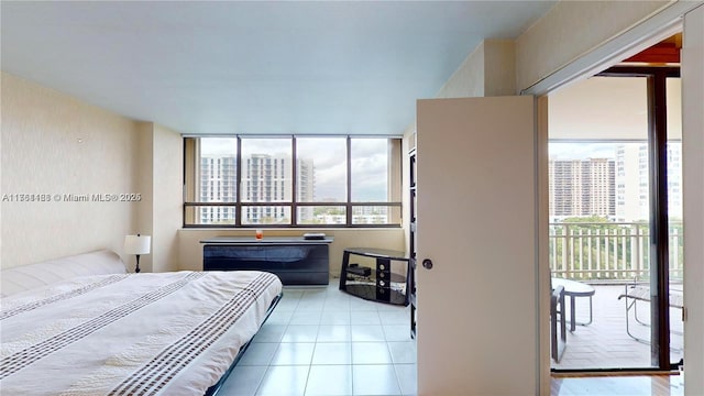 tiled bedroom featuring a view of city and access to exterior