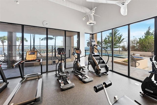 gym with a towering ceiling