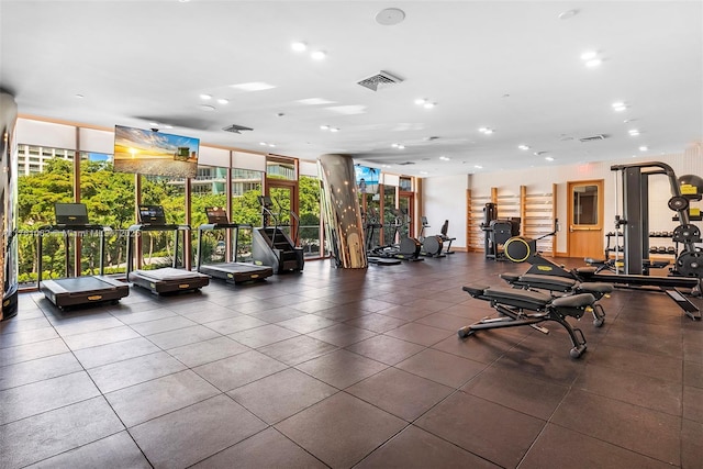 exercise room with recessed lighting, visible vents, and floor to ceiling windows