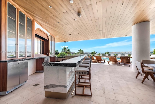 view of patio featuring outdoor wet bar