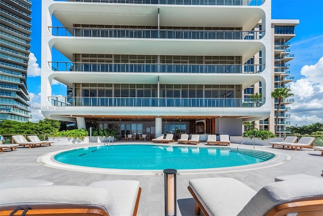 community pool featuring a patio area