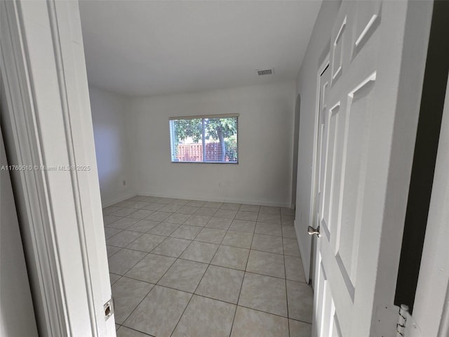 spare room with light tile patterned floors and visible vents