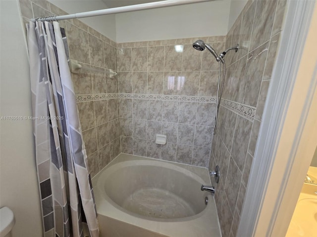 full bathroom with shower / tub combo and toilet