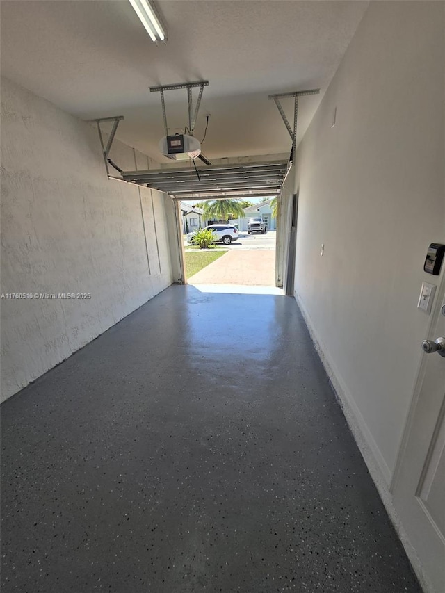 garage featuring a garage door opener