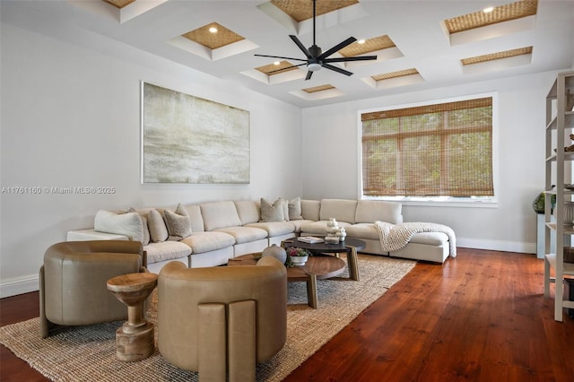 living area with baseboards, coffered ceiling, and hardwood / wood-style flooring