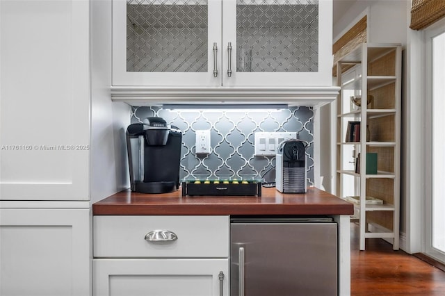 interior space with fridge and wood finished floors