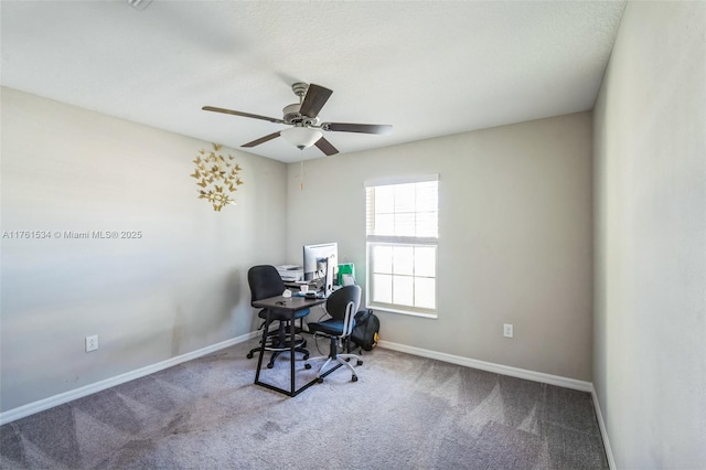 office area with baseboards, carpet, and a ceiling fan