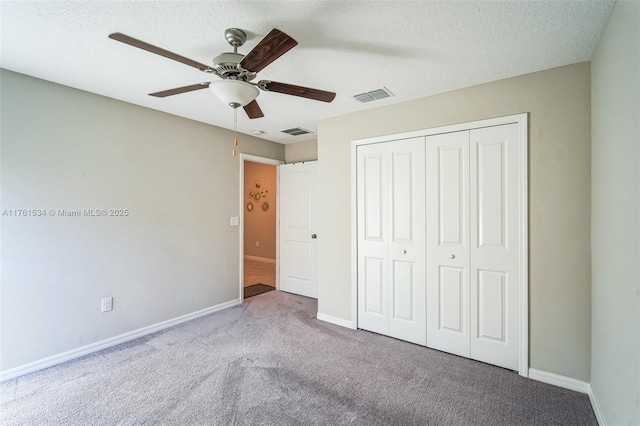 unfurnished bedroom with visible vents, baseboards, and a closet