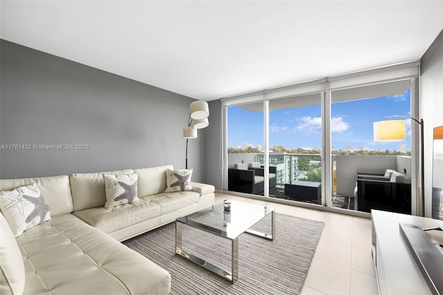 tiled living room with a wall of windows