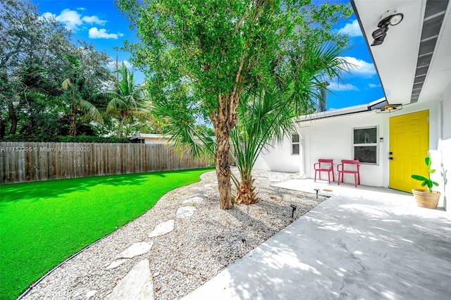 view of yard featuring a patio area and fence private yard