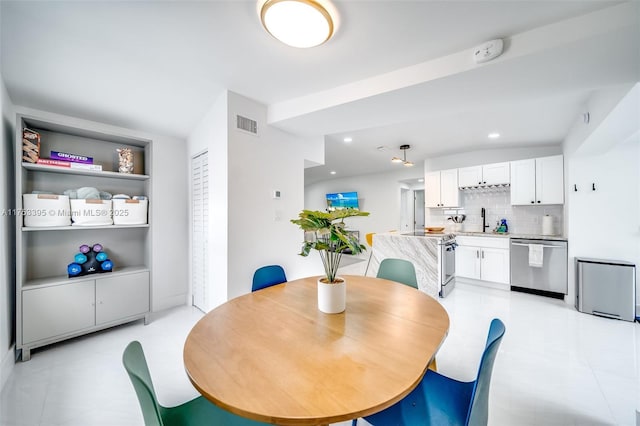 dining room with visible vents and recessed lighting