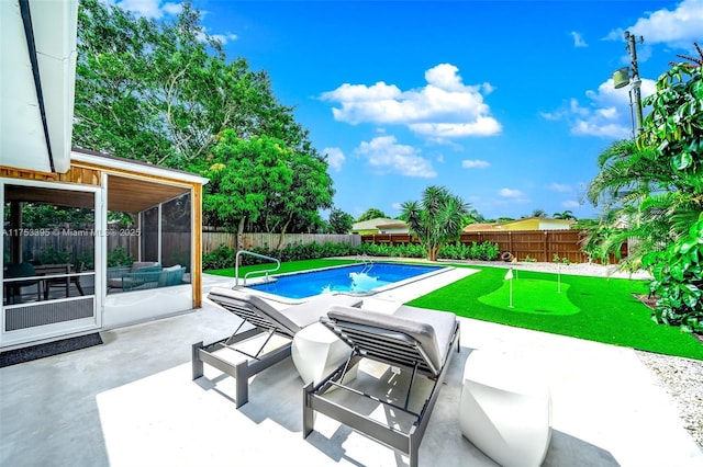 view of swimming pool with a fenced in pool, area for grilling, a fenced backyard, a sunroom, and a patio area