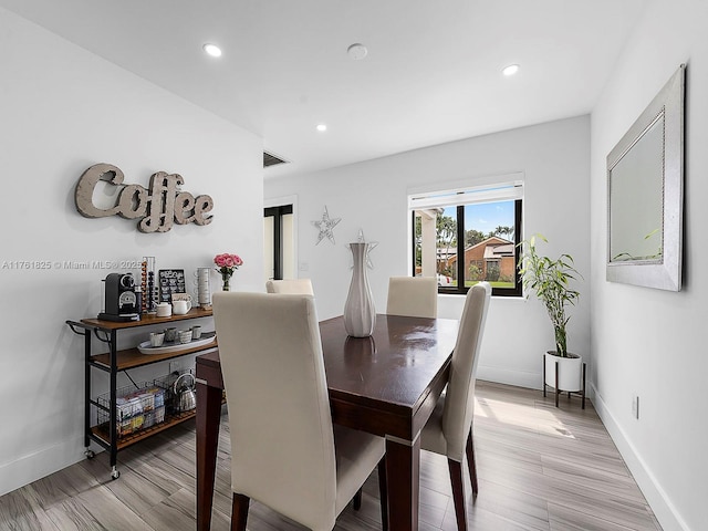 dining room featuring recessed lighting, visible vents, baseboards, and light wood-style flooring