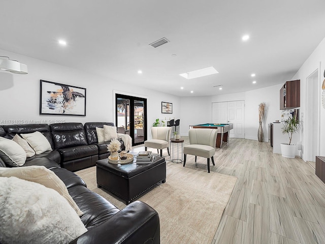 living room with billiards, visible vents, a skylight, recessed lighting, and light wood-style floors