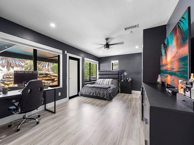 bedroom featuring visible vents, baseboards, light wood-type flooring, recessed lighting, and a ceiling fan