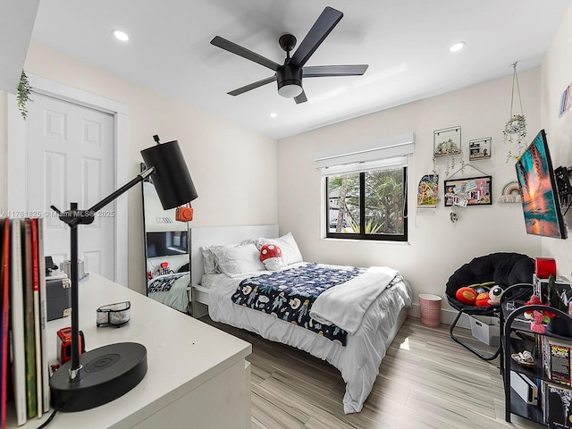 bedroom with recessed lighting, light wood-type flooring, and a ceiling fan