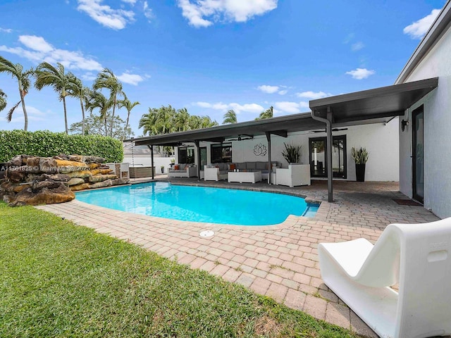 view of swimming pool featuring a patio area, a fenced in pool, and outdoor lounge area