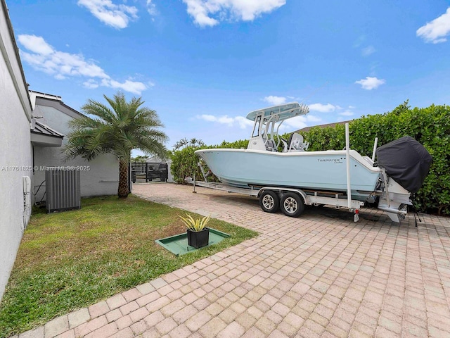 exterior space with cooling unit and fence