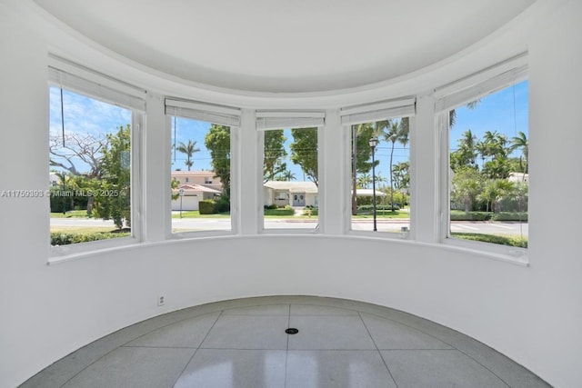 unfurnished sunroom with a wealth of natural light