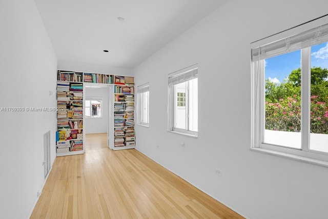 recreation room featuring visible vents and light wood-type flooring