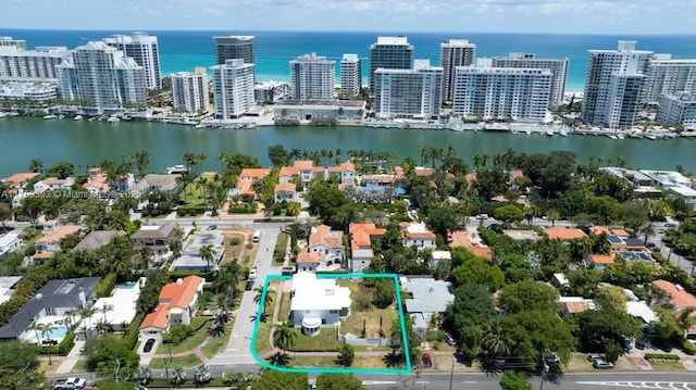 bird's eye view featuring a water view and a view of city