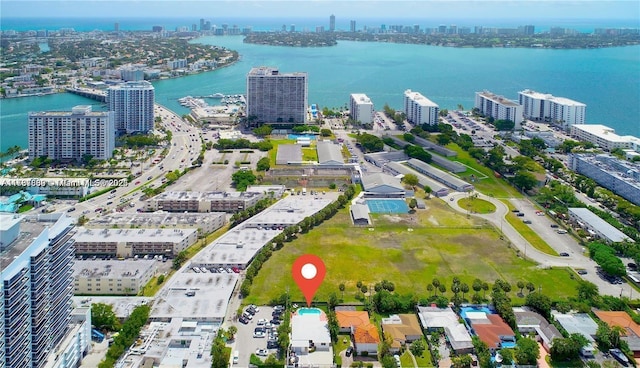 drone / aerial view featuring a water view and a city view