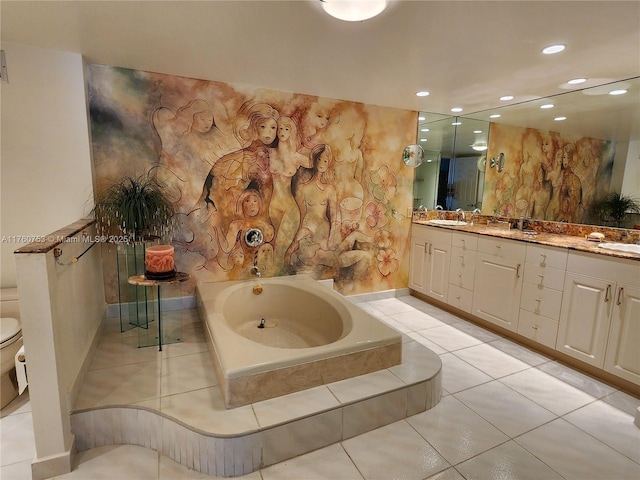 bathroom featuring vanity, baseboards, recessed lighting, toilet, and a bath