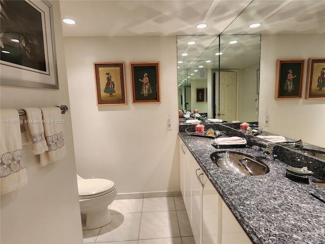 bathroom featuring tile patterned flooring, baseboards, toilet, recessed lighting, and vanity