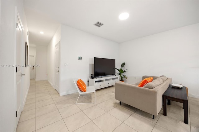 living room featuring light tile patterned floors, recessed lighting, visible vents, and baseboards