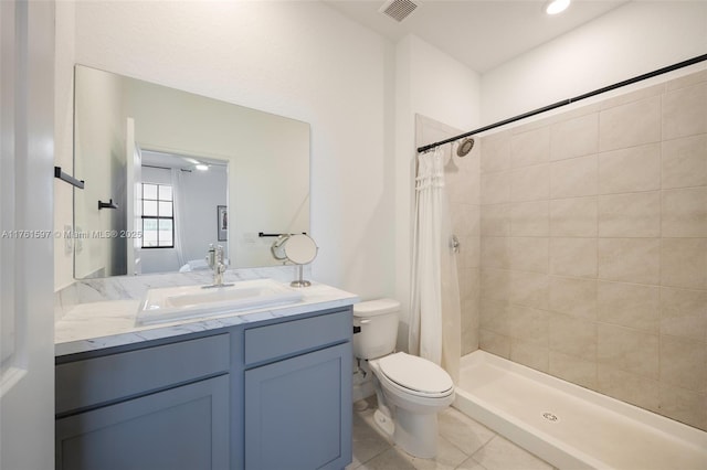 bathroom with visible vents, toilet, a shower stall, tile patterned flooring, and vanity