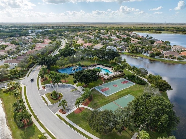 bird's eye view with a residential view and a water view