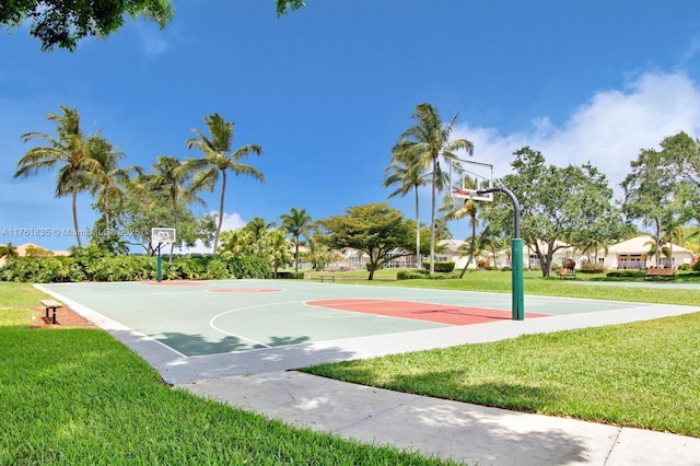 view of basketball court with a yard and community basketball court