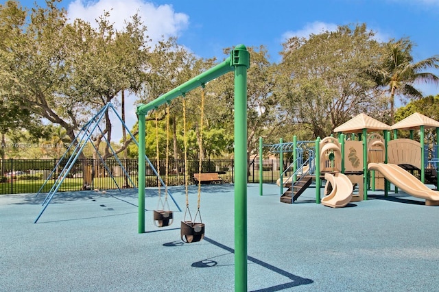 communal playground featuring fence