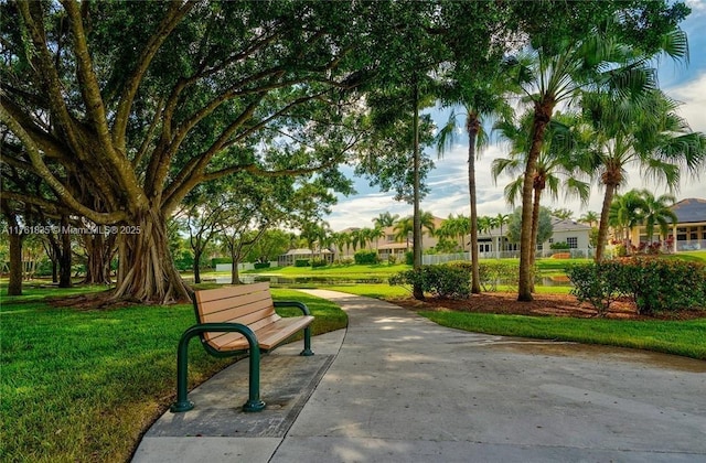 view of home's community featuring a residential view and a yard