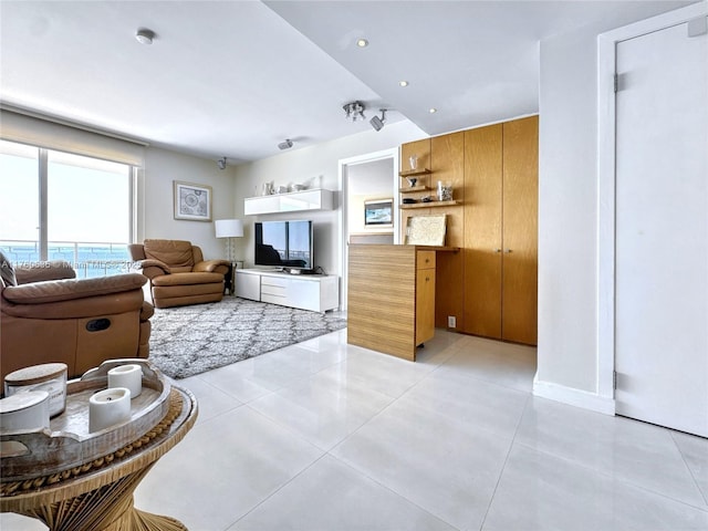 living area featuring light tile patterned floors