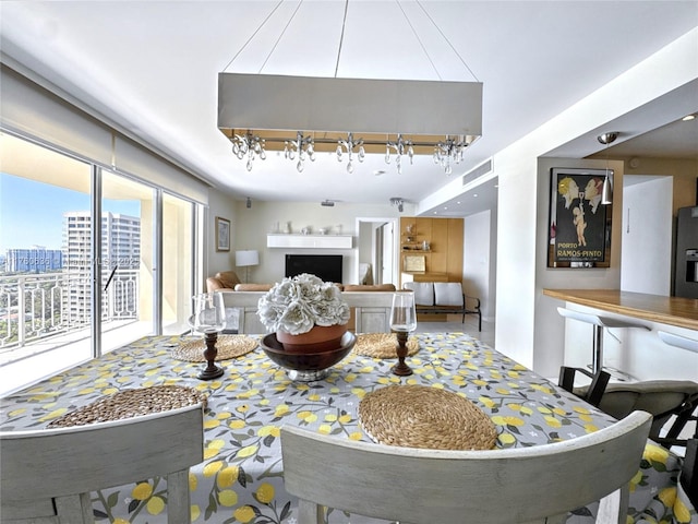 living room featuring visible vents and a fireplace