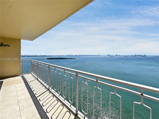 balcony featuring a water view