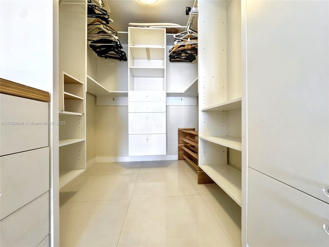 walk in closet featuring light tile patterned floors