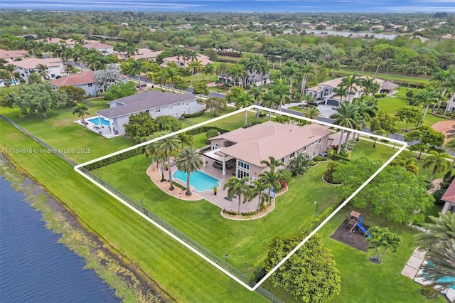 birds eye view of property with a residential view and a water view