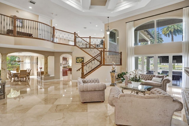 living room with crown molding, baseboards, stairs, arched walkways, and marble finish floor