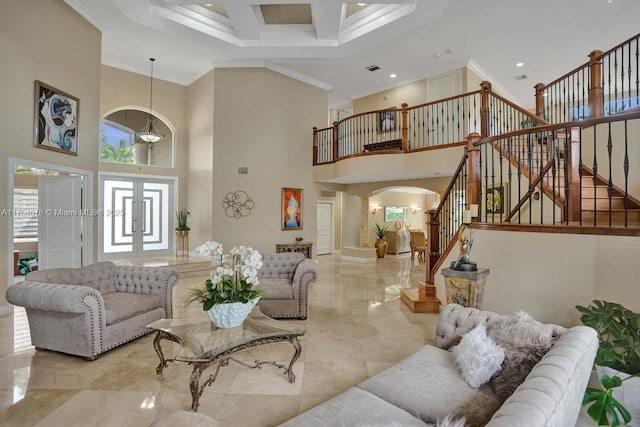 living room featuring plenty of natural light, stairway, and crown molding