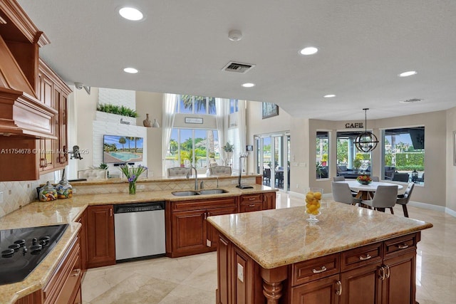 kitchen featuring visible vents, dishwasher, black electric cooktop, and a sink