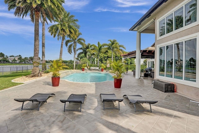 view of pool with a fenced in pool, a patio, and fence