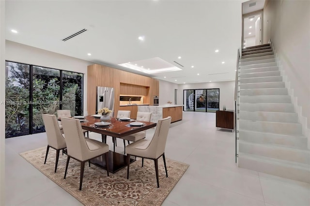 dining area with stairway, recessed lighting, and visible vents