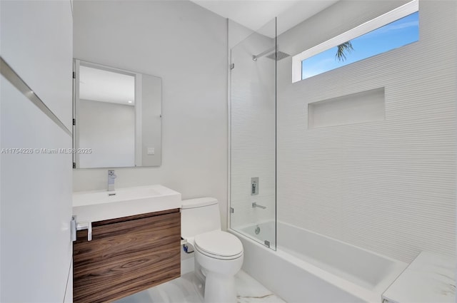 full bath featuring toilet, vanity, and shower / tub combination