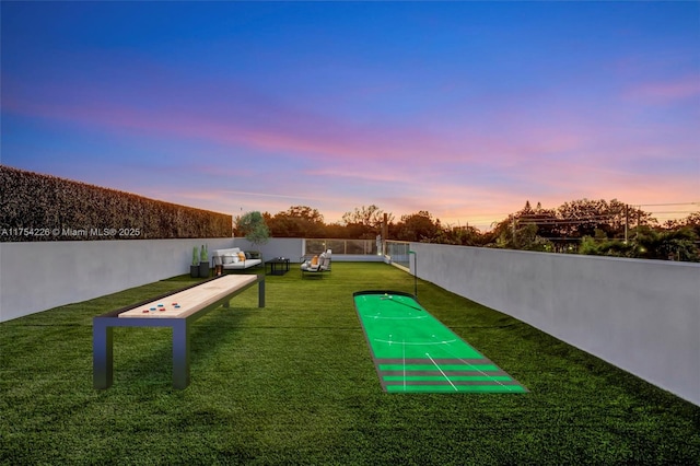 surrounding community with fence and a lawn